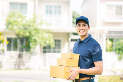 Determined mail carrier delivering packages, highlighting the physically demanding nature of the job and potential for injury.